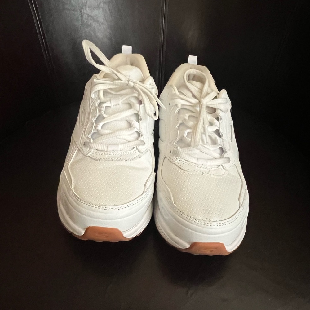 Skechers white running sneakers.